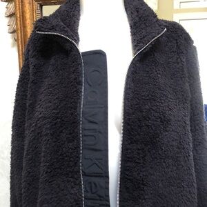 New Calvin Klein fuzzy full zip black jacket.  Size L.  Warm and cozy!